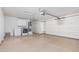 Spacious garage featuring ample storage with built-in cabinets and laundry area at 9204 N 106Th Way, Scottsdale, AZ 85258
