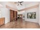 Open living space featuring tile floors, built-in shelving, and bright window views at 9204 N 106Th Way, Scottsdale, AZ 85258