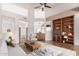 Open concept living area with vaulted ceilings, built-in shelves, and comfortable seating at 9204 N 106Th Way, Scottsdale, AZ 85258