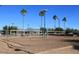 Sandy outdoor volleyball court ready for play, set against a backdrop of palm trees and clear skies at 9204 N 106Th Way, Scottsdale, AZ 85258