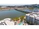 Aerial view shows a community pool and outdoor lounging area on the waterfront near a bridge with vehicle traffic at 945 E Playa Del Norte Dr # 1003, Tempe, AZ 85288