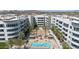 Panoramic aerial view of the community, showcasing a beautiful pool, lush landscaping, and modern architecture at 945 E Playa Del Norte Dr # 1003, Tempe, AZ 85288