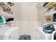 Practical laundry room with updated appliances and ample shelf space at 945 E Playa Del Norte Dr # 1003, Tempe, AZ 85288
