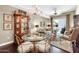 Open-plan living space with a chandelier, stylish seating, and access to the outdoor area at 945 E Playa Del Norte Dr # 1003, Tempe, AZ 85288