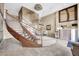 Grand lobby featuring a curved staircase, stylish chandelier, and concierge desk at 945 E Playa Del Norte Dr # 1003, Tempe, AZ 85288