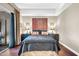 Comfortable main bedroom featuring an decorative headboard and warm lighting at 945 E Playa Del Norte Dr # 1003, Tempe, AZ 85288