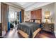 Comfortable main bedroom featuring an decorative headboard and a private balcony at 945 E Playa Del Norte Dr # 1003, Tempe, AZ 85288