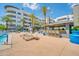 Community pool with poolside outdoor kitchen and bar seating near the lake at 945 E Playa Del Norte Dr # 1003, Tempe, AZ 85288