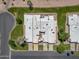 Aerial view of the community showing roofs and landscaping at 9847 E Michigan Ave, Sun Lakes, AZ 85248