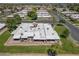 Gorgeous home surrounded by lush landscaping, mature trees, and a well-manicured lawn at 9847 E Michigan Ave, Sun Lakes, AZ 85248
