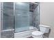 Updated bathroom featuring a glass enclosed shower and tile surround at 9847 E Michigan Ave, Sun Lakes, AZ 85248