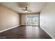 Bright bedroom with patio access and modern ceiling fan at 9847 E Michigan Ave, Sun Lakes, AZ 85248