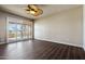 Spacious bedroom with ceramic tile flooring leading to a private balcony with views at 9847 E Michigan Ave, Sun Lakes, AZ 85248