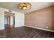 Spacious bedroom features ceramic tile flooring and a stylish ceiling fan with light at 9847 E Michigan Ave, Sun Lakes, AZ 85248