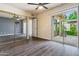 Bedroom featuring ceiling fan, closet, and view of backyard at 9847 E Michigan Ave, Sun Lakes, AZ 85248