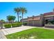 Beautiful single-story home showcasing mature trees, a well-kept lawn, and a convenient three-car garage with tile roofing at 9847 E Michigan Ave, Sun Lakes, AZ 85248