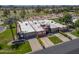 Stunning home featuring desert landscaping, a two-car garage, and mature palm trees at 9847 E Michigan Ave, Sun Lakes, AZ 85248