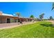 Exterior shot displaying the well-kept lawns and landscaping in this lovely community at 9847 E Michigan Ave, Sun Lakes, AZ 85248