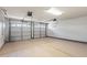 Large two-car garage with ample space and painted floor at 9847 E Michigan Ave, Sun Lakes, AZ 85248
