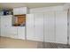 Ample garage storage with cabinets, drawers and countertop at 9847 E Michigan Ave, Sun Lakes, AZ 85248