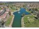 Overhead view of the golf course featuring lush greenery, a tranquil pond, and beautiful landscaping at 9847 E Michigan Ave, Sun Lakes, AZ 85248
