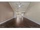 Vaulted ceiling, wood-look tile flooring, with views into bright kitchen of open concept living space at 9847 E Michigan Ave, Sun Lakes, AZ 85248