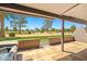 Enjoy the views from this covered patio with a hot tub and gate to the community green space at 9847 E Michigan Ave, Sun Lakes, AZ 85248