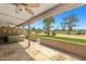 Covered patio features a golf course view and a private hot tub, perfect for relaxing and entertaining at 9847 E Michigan Ave, Sun Lakes, AZ 85248