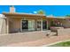 Private patio with stucco wall and sliding glass doors at 9847 E Michigan Ave, Sun Lakes, AZ 85248