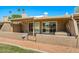 Cozy patio with stucco walls, gate and view of blue sky at 9847 E Michigan Ave, Sun Lakes, AZ 85248