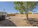 Large backyard area with desert landscaping, fenced perimeter, shed and a mature shade tree at 10951 N 91St Ave # 32, Peoria, AZ 85345