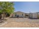 The spacious backyard includes a storage shed, desert landscaping, a mature tree, and a privacy fence at 10951 N 91St Ave # 32, Peoria, AZ 85345