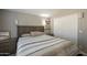 Bedroom features a high ceiling, wooden accents, and side closet at 10951 N 91St Ave # 32, Peoria, AZ 85345