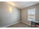 Empty bedroom with a neutral wall color, carpet, a window, and a desk at 10951 N 91St Ave # 32, Peoria, AZ 85345