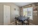 Cozy dining area featuring natural light and a table with four chairs at 10951 N 91St Ave # 32, Peoria, AZ 85345