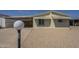 Charming home featuring a carport, low-maintenance landscaping and neutral tones at 10951 N 91St Ave # 32, Peoria, AZ 85345