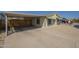 Inviting home with a convenient carport and easy-care gravel landscaping at 10951 N 91St Ave # 32, Peoria, AZ 85345