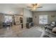 Open-concept living space with wood-look floors and abundant natural light at 10951 N 91St Ave # 32, Peoria, AZ 85345