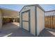 A shed located in the backyard, offering additional storage space for tools and equipment at 10951 N 91St Ave # 32, Peoria, AZ 85345