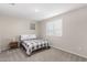 Bedroom featuring neutral walls, plush carpeting, and comfortable furnishings for ultimate relaxation at 10983 W Mckinley St, Avondale, AZ 85323