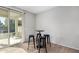 Cozy breakfast nook with access to the backyard and seating for four, perfect for casual dining at 10983 W Mckinley St, Avondale, AZ 85323