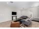 Tastefully decorated living room featuring sleek furniture, modern lighting, and a staircase at 10983 W Mckinley St, Avondale, AZ 85323