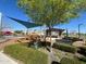 Playground offers a unique wooden play structure, shade, and seating at 10983 W Mckinley St, Avondale, AZ 85323