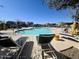 Bright pool area with lounge chairs and views of nearby homes at 10983 W Mckinley St, Avondale, AZ 85323