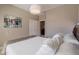 Bedroom featuring a queen size bed, closet doors, and artwork at 132 E El Prado Dr, Queen Creek, AZ 85140