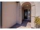 Inviting entryway featuring a decorative front door and brick-paved flooring at 132 E El Prado Dr, Queen Creek, AZ 85140