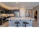 Modern kitchen with stainless steel appliances and a spacious center island at 132 E El Prado Dr, Queen Creek, AZ 85140