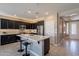 Stylish kitchen with sleek cabinetry, an island with seating, and modern appliances at 132 E El Prado Dr, Queen Creek, AZ 85140