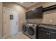 Laundry room featuring front load washer and dryer, cabinets and countertop at 132 E El Prado Dr, Queen Creek, AZ 85140