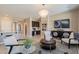 Open-concept living space with stylish decor and a view into other rooms at 132 E El Prado Dr, Queen Creek, AZ 85140